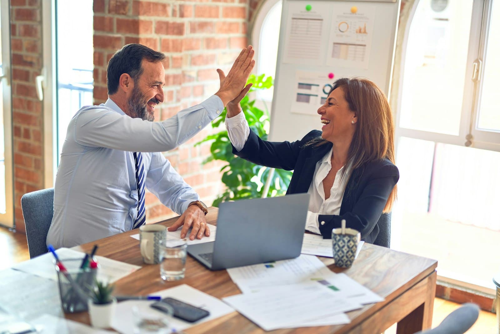 Immigration attorneys collaborating on PERM case strategy