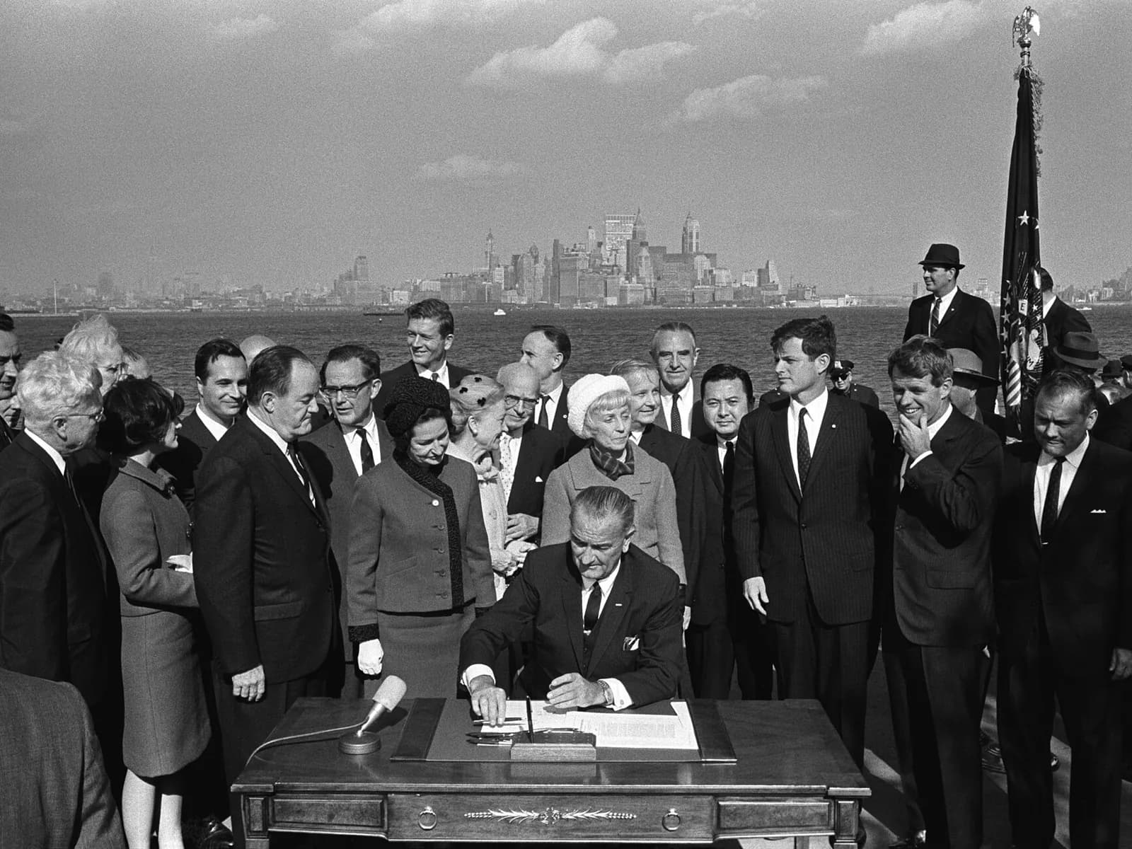 President Lyndon B. Johnson signing the Immigration and Nationality Act of 1965 at Liberty Island, the law that made labor certification part of employment-based immigration